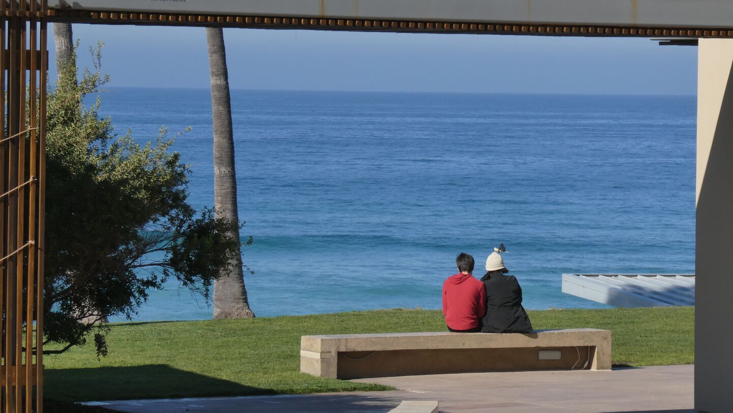 The Pacific draws a couple of admirers at La Jolla Shores.