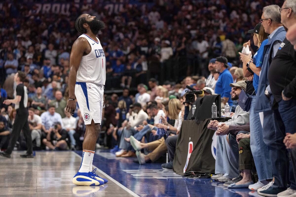 Clippers guard James Harden looks up at the crowd in Dallas during the second half of Game 4.