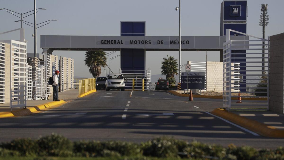 Cars leave the General Motors assembly plant in Villa de Reyes, Mexico, in January 2017. Aveo and Trax vehicles have been produced at the factory since 2008.