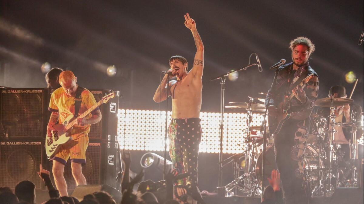 From left to right, Flea and Anthony Kiedis of Red Hot Chili Peppers perform with Post Malone onstage during the at the 61st Grammy Awards.