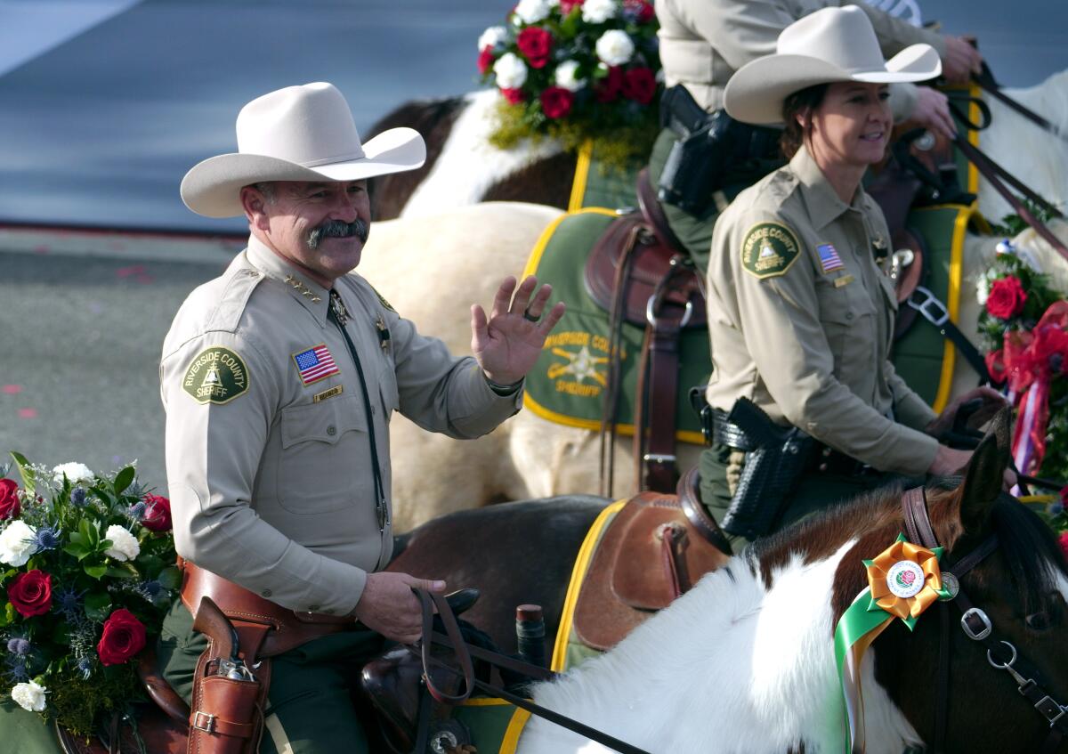 Riverside County Sheriff Chad Bianco, left, during the 134th Rose Parade in Pasadena on Jan. 2, 2023.