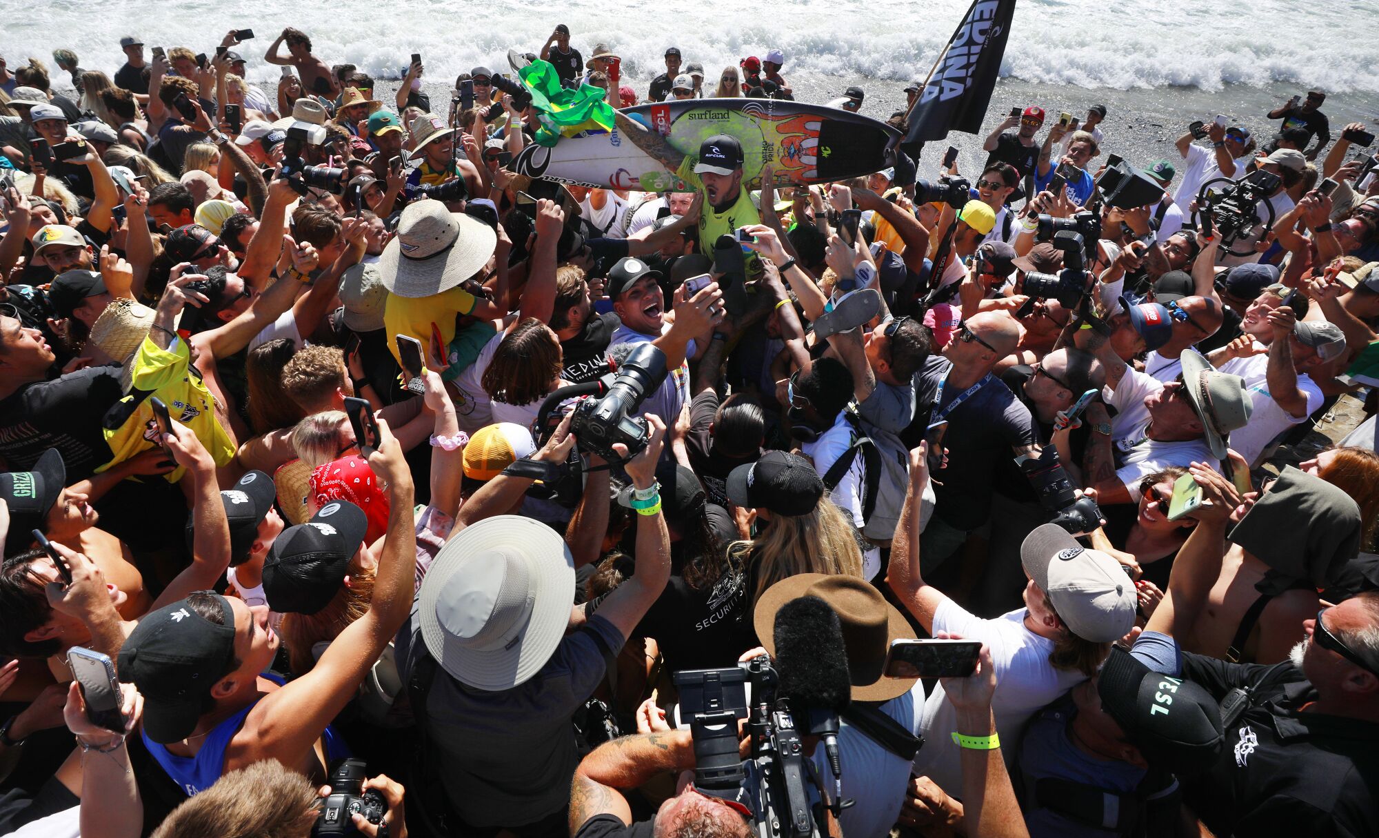 Gabriel Medina of Brazil celebrates with fans after he won the world championship at the World Surf 