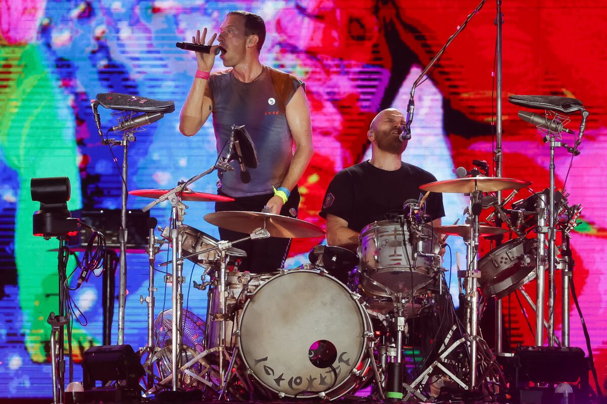 Chris Martin and Will Champion of Coldplay, 2022 Rock in Rio Festival in Brazil.