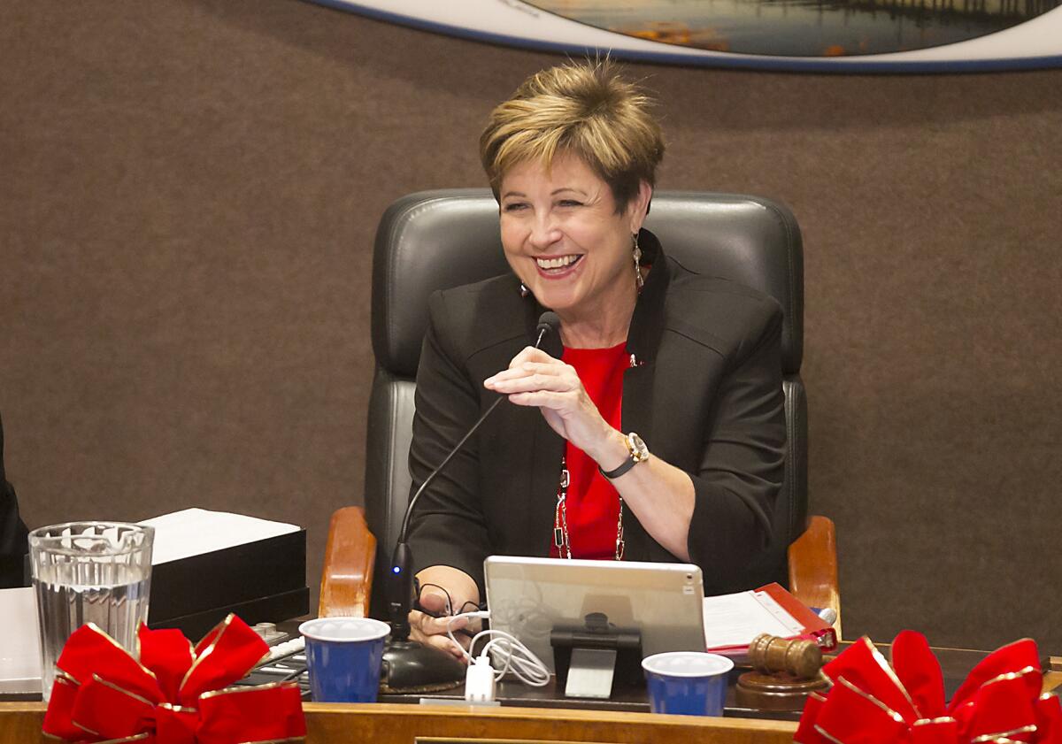 Barbara Delgleize takes the mayor’s chair after her selection by the Huntington Beach City Council on Monday.