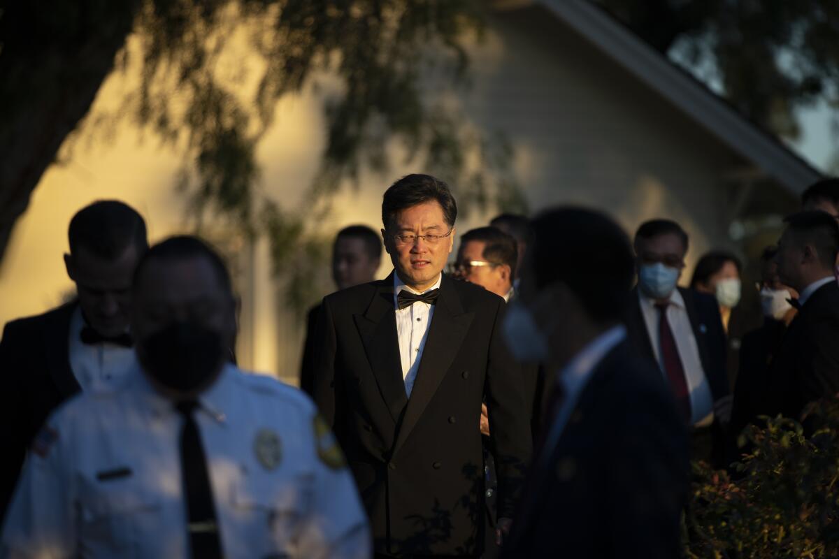 Chinese ambassador Qin Gang in a tuxedo outside the Nixon library