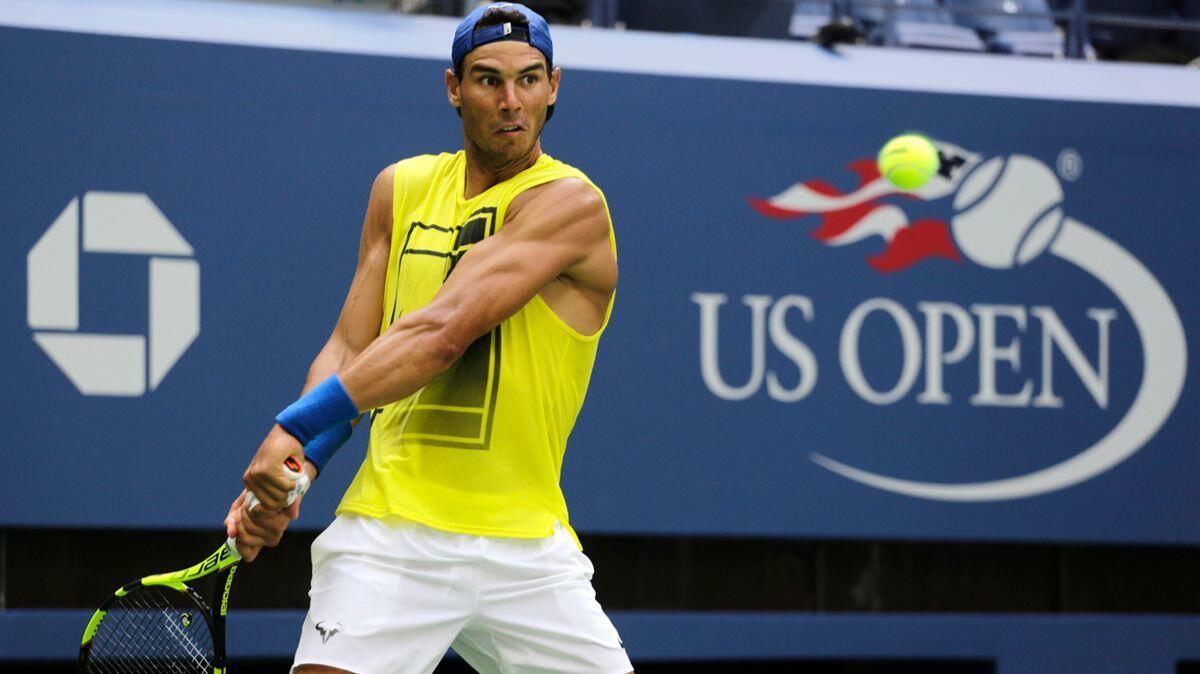 Rafael Nadal returns a shot during practice at the U.S. Open on Sunday. Competition starts on Monday.