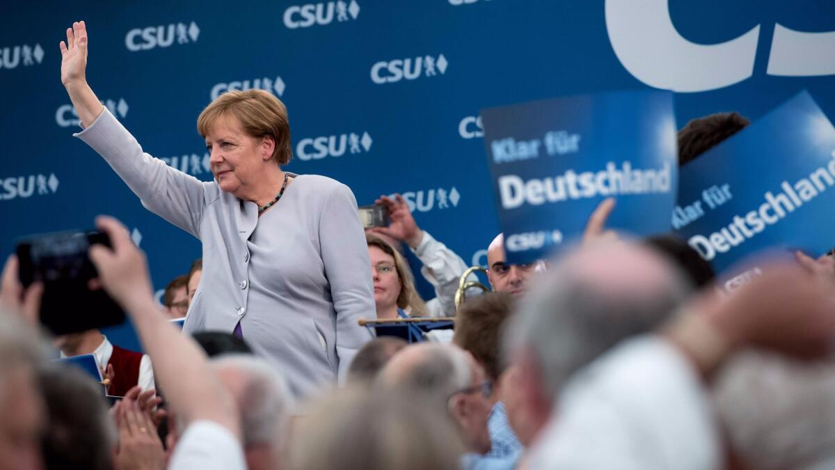 German Chancellor Angela Merkel waves after giving a speech during an election campaign event in a beer tent in Munich, southern Germany, on May 28, 2017.