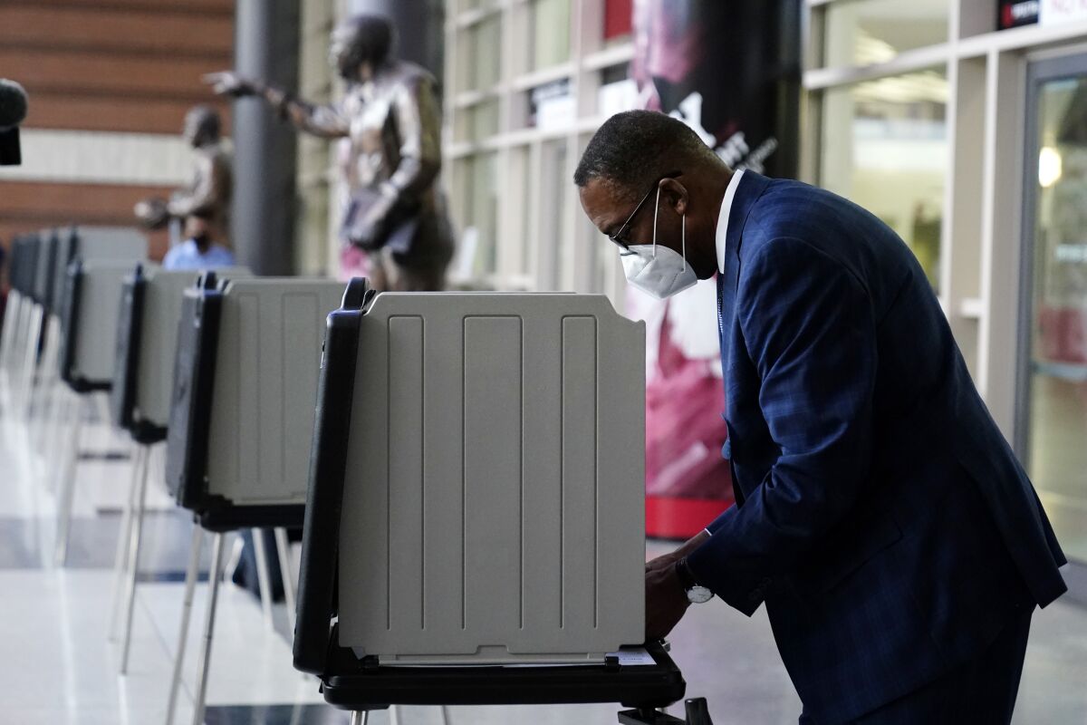 Philadelphia City Council President Darrell L. Clarke votes at a satellite election office at Temple University on Sept. 29. 