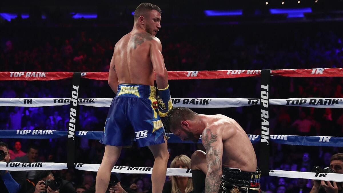 Vasiliy Lomachenko knocks down Jorge Linares in the 10th round during their WBA lightweight title fight at Madison Square Garden.