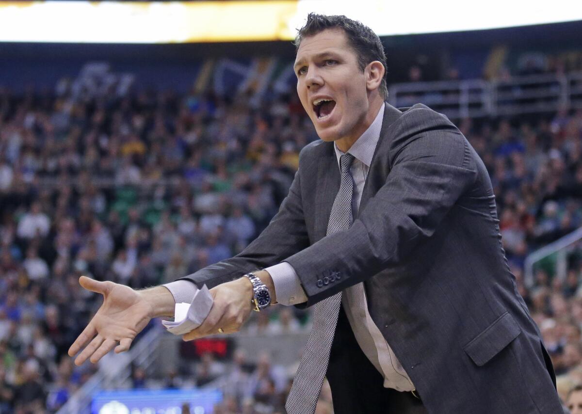 Warriors interim coach Luke Walton shouts to his team during the second quarter of a game against the Jazz on Nov. 30.