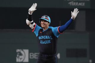 National League's Shohei Ohtani, of the Los Angeles Dodgers, runs the bases after hitting a home run during the third inning of the MLB All-Star baseball game, Tuesday, July 16, 2024, in Arlington, Texas. Jurickson Profar, of the San Diego Padres, and Ketel Marte, of the Arizona Diamondbacks, also scored. (AP Photo/LM Otero)