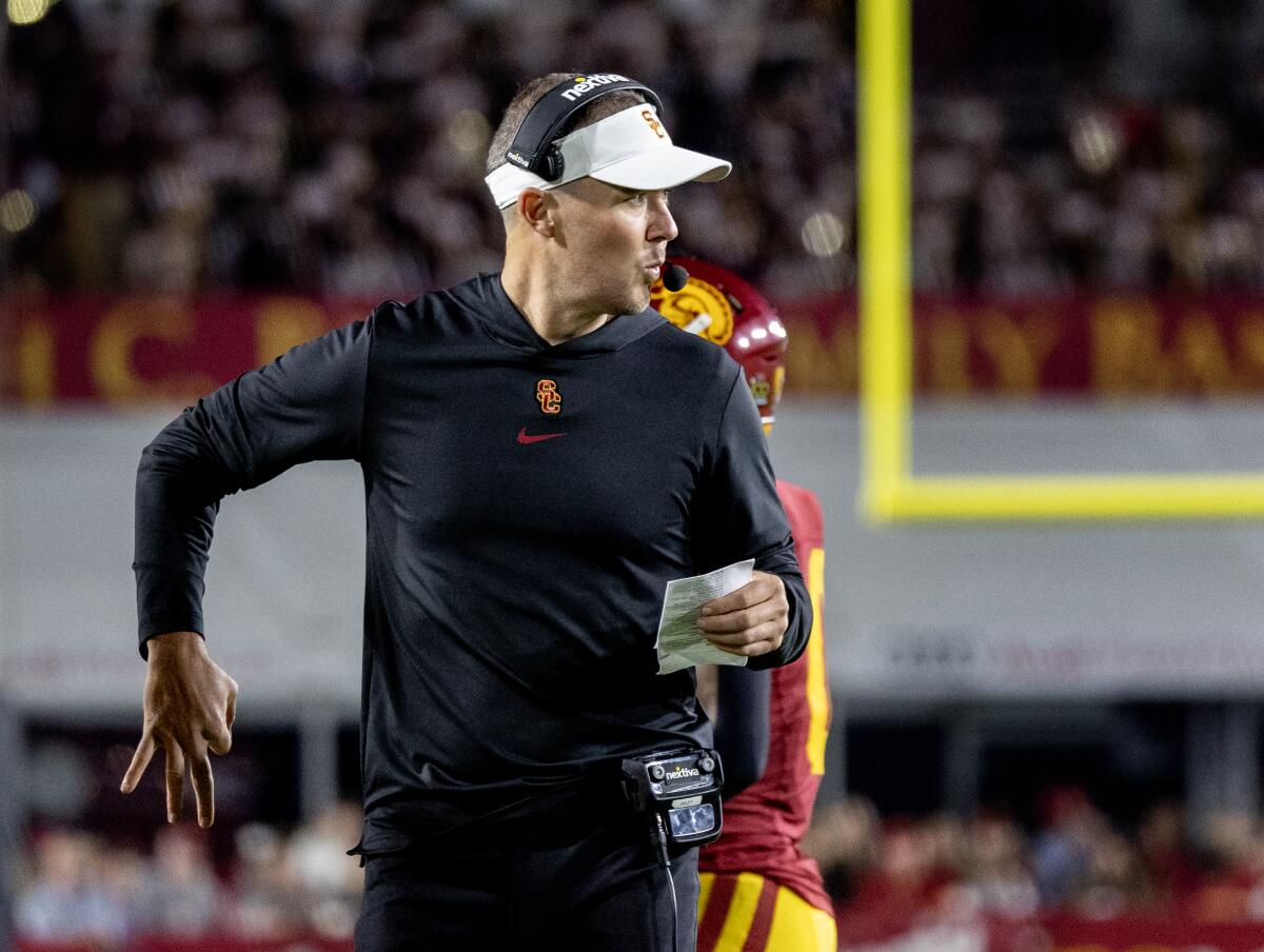 LOS ANGELES, CA - OCTOBER 7, 2023: USC Trojans head coach Lincoln Riley calls an offensive play.