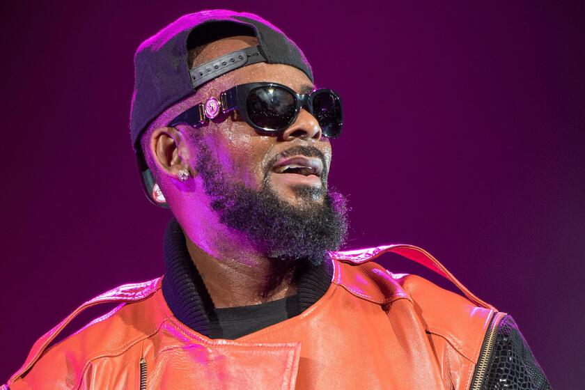FILE - JULY 11: Singer R. Kelly was arrested on federal sex trafficking charges on July 11, 2019 in Chicago, Illinois. NEW YORK, NY - SEPTEMBER 25: R. Kelly performs in concert at Barclays Center on September 25, 2015 in the Brooklyn borough of New York City. (Photo by Mike Pont/Getty Images) ** OUTS - ELSENT, FPG, CM - OUTS * NM, PH, VA if sourced by CT, LA or MoD **