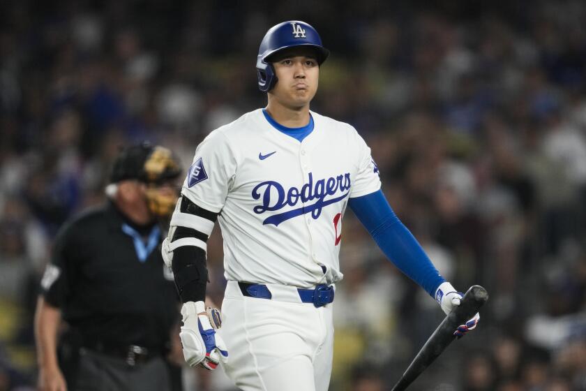 Los Angeles Dodgers designated hitter Shohei Ohtani (17) reacts after striking out swinging.