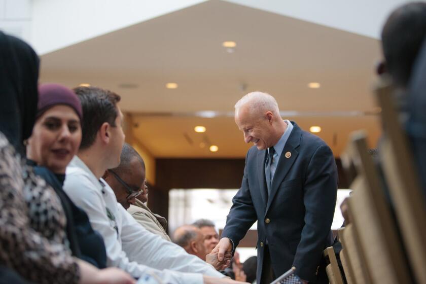 Denver, CO - FEBRUARY 22, 2018: Rep. Mike Coffman (CO-06) talks with people before a USCIS Ceremony (there were 44 new citizens naturalized during the ceremony in the History Colorado Center) in Denver, Colorado on Wednesday, February 22, 2018. (Photo by Matthew Staver / For the Times)