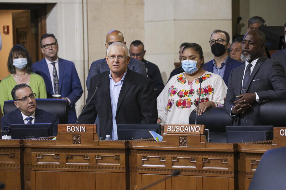 Councilmember Mike Bonin addresses a City Council meeting last week, with Councilmember-elect Eunisses Hernandez  behind him.