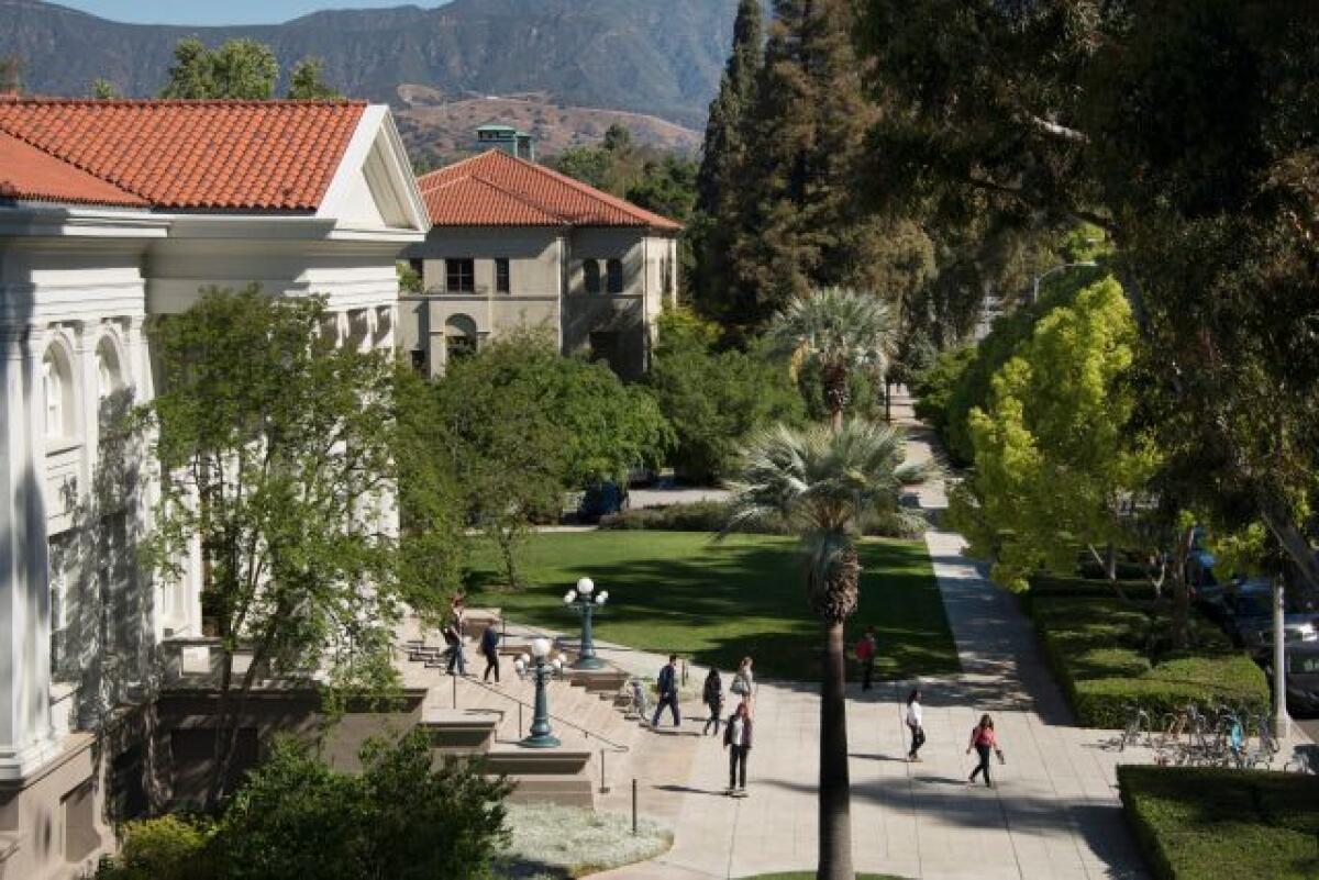 Students walk outside building at Pomona College