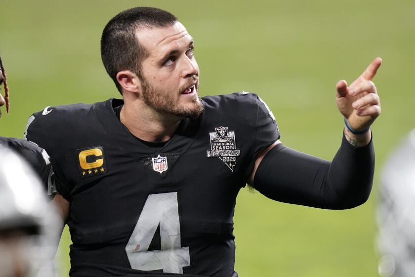 Las Vegas Raiders quarterback Derek Carr #4 leaves the field after losing to the Kansas City Chiefs in an NFL football game, Sunday, Nov. 22, 2020, in Las Vegas. (AP Photo/Jeff Bottari)