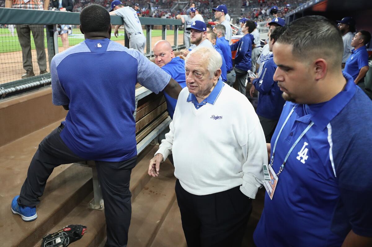 Former Dodgers manager Tommy Lasorda stands in the dugout before Game Three of the 2018 National League Division Series between the Dodgers and Atlanta Braves.