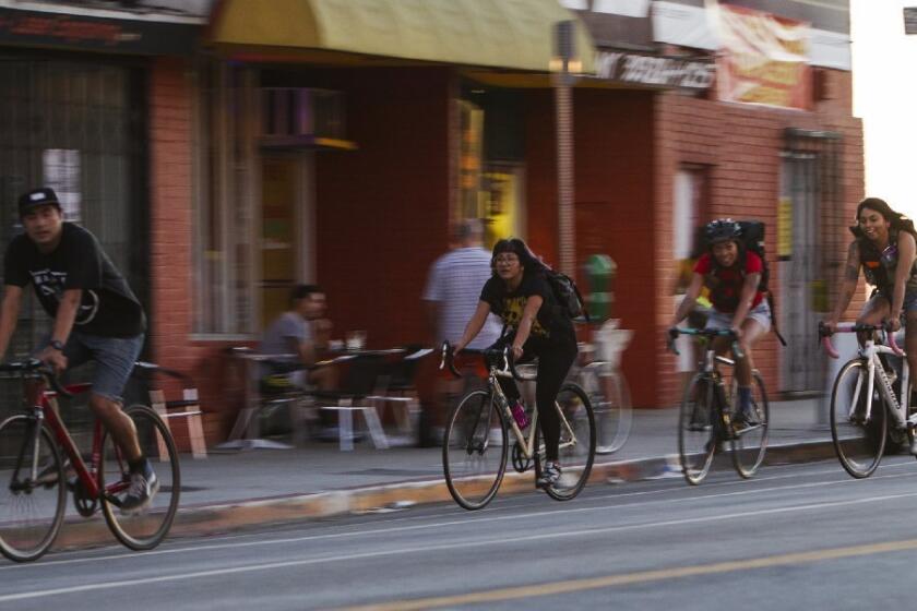 Bicyclists on 1st Street across from Mariachi Plaza in East Los Angeles, where city officials are considering more bike lanes to accommodate a growing number of two-wheeled commuters and pleasure riders.