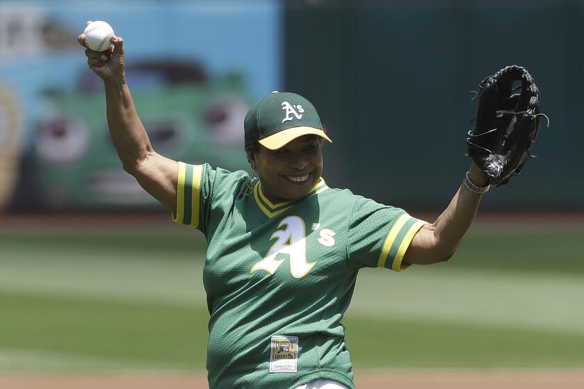 Rep. Barbara Lee prepares to throw a ceremonial first pitch before a game between the Athletics and Padres on July 4, 2018.