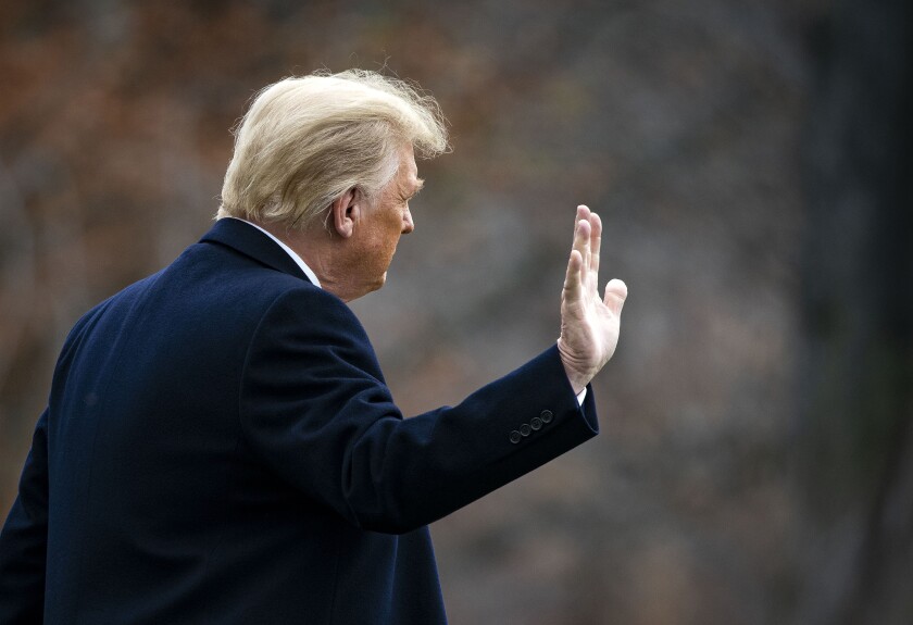 President Trump waves as he departs the White House on Dec. 12, 2020.