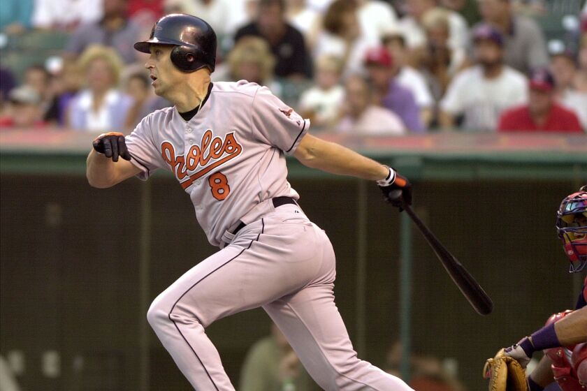 CLEVELAND, UNITED STATES: Baltimore Orioles' designated hitter Cal Ripken watches his single off Cleveland Indians' pitcher Chuck Finley in his first at bat since missing 59 games while on the disabled list in the second inning on, 01 September 2000, at Jacobs Field in Cleveland. Cleveland defeated Baltimore 5-2.(ELECTRONIC IMAGE) AFP PHOTO/David MAXWELL (Photo credit should read DAVID MAXWELL/AFP via Getty Images)