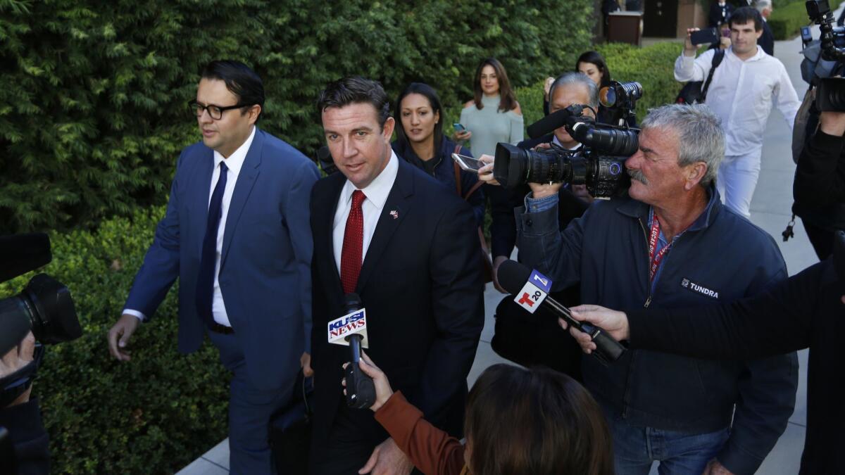 U.S. Rep. Duncan Hunter leaves a federal courthouse in San Diego after a hearing on on Dec. 3, 2018. Hunter and his wife Margaret Hunter who served as his campaign chair will go to trial in September.