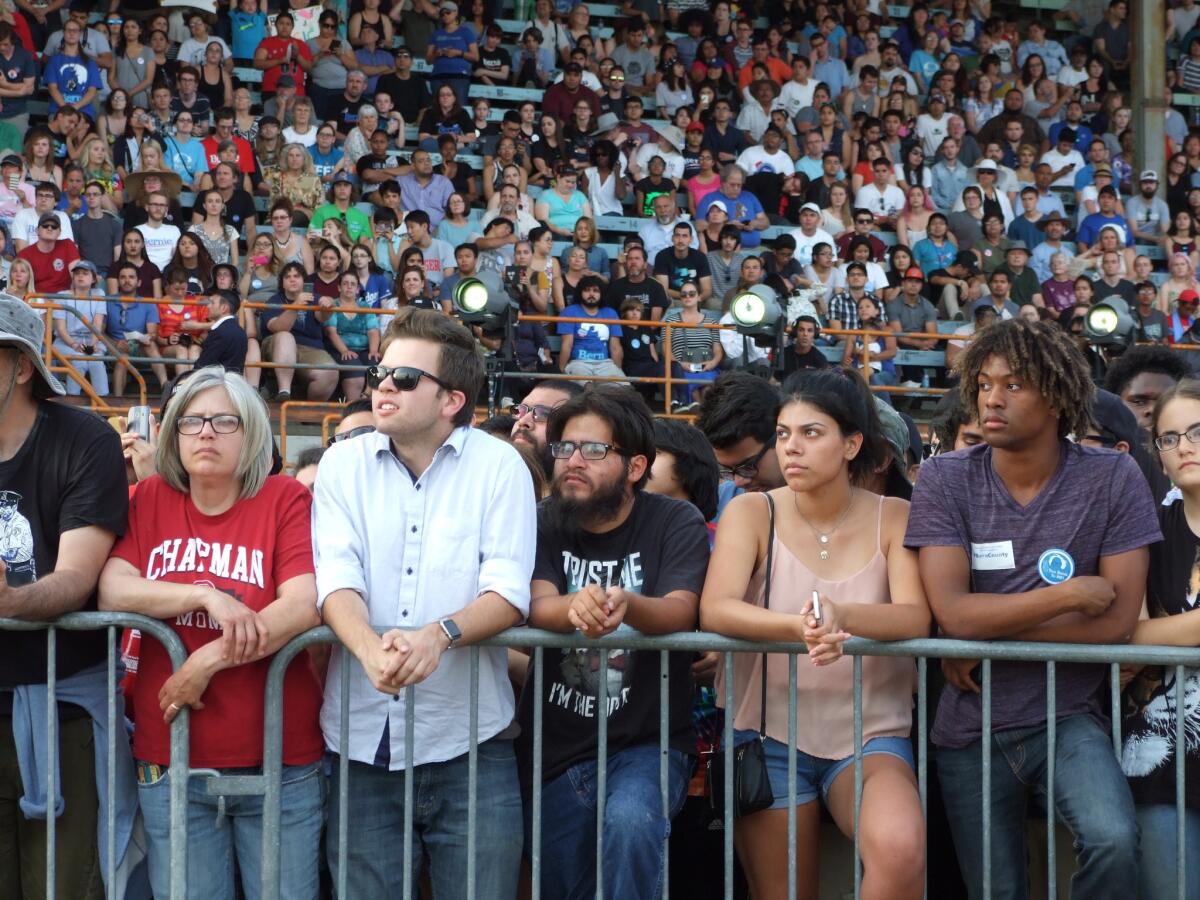 A crowd of supporters listen to Bernie Sanders speak at a rally in Bakersfield.