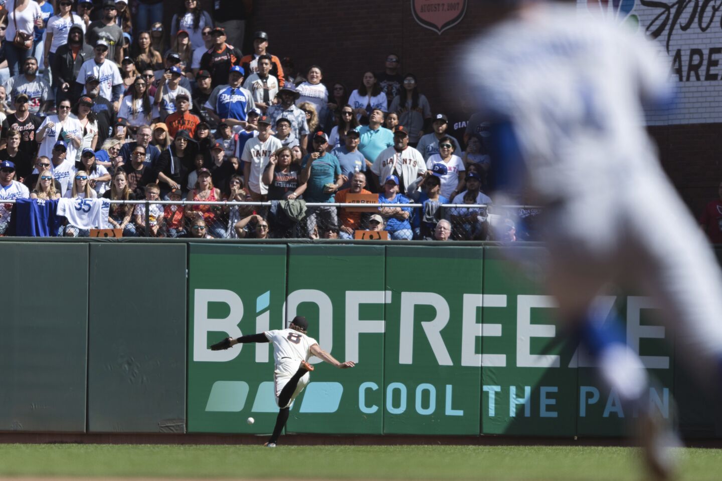 San Francisco Giants right fielder Hunter Pence fails to catch a deep fly ball off the bat of Los Angeles Dodgers batter Enrique Hernandez, not shown, in the fifth inning of a baseball game in San Francisco, Sunday, Sept. 30, 2018.