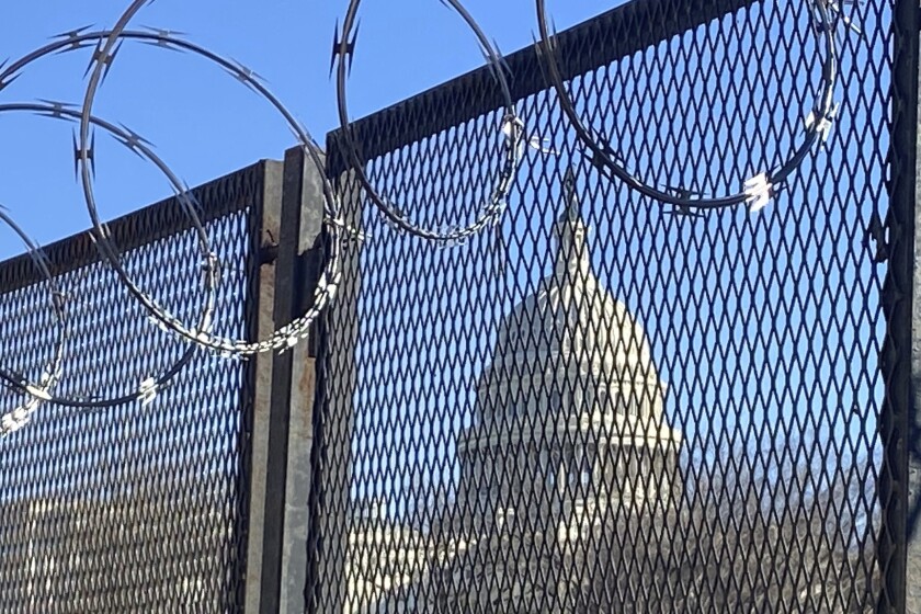 Fencing and razor wire reinforce the security zone on Capitol Hill in Washington. 
