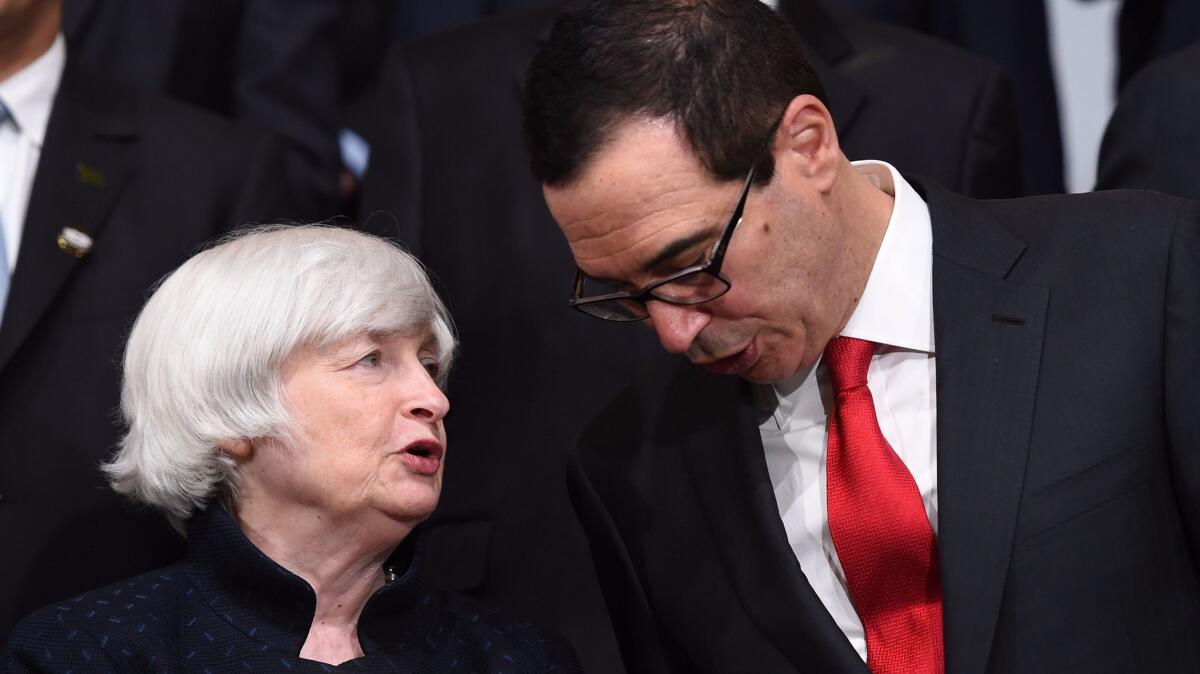 Federal Reserve Chairwoman Janet L. Yellen speaks with Treasury Secretary Steven T. Mnuchin at the G20 meeting in Washington on Oct. 12.