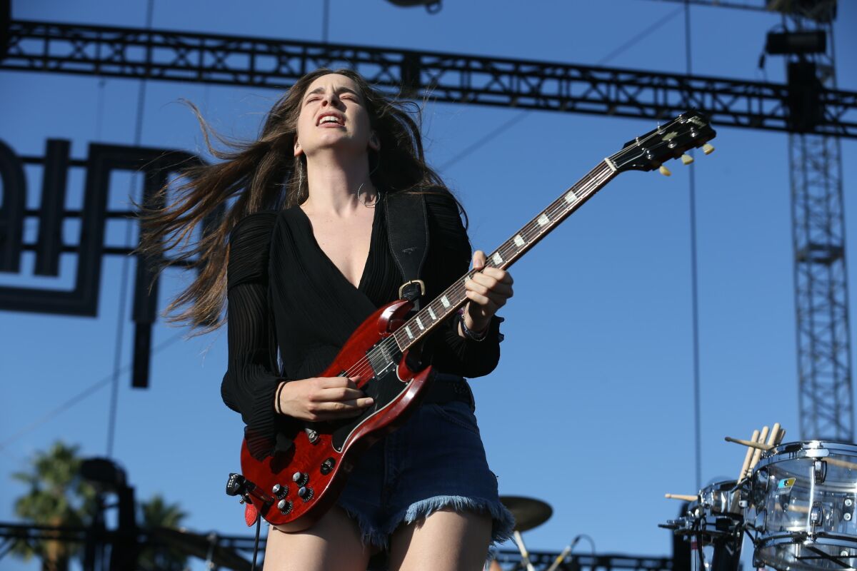 Danielle Haim of the L.A. band Haim performs Friday at the Coachella Valley Music and Arts Festival.