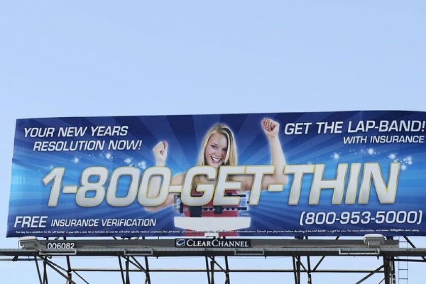 Billboards plastered across Southern California freeways with ads such as this one display the smiling faces of thin people and catchy phrases about the benefits of Lap-Band weight-loss surgery. There are warnings about the risks, but the typeface is so small it’s not legible, the Food and Drug Administration said.