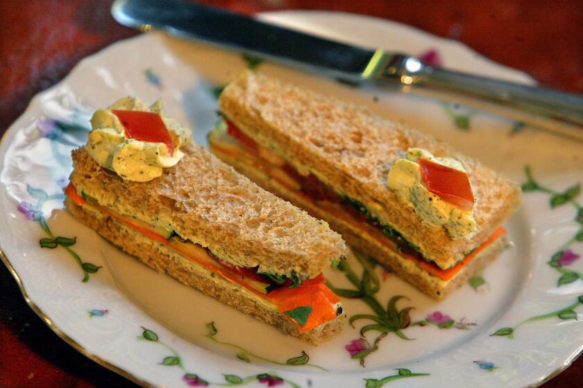 Photo of cucumber/tomato sandwiches. The Peninsula Beverly Hills Hotel serves classy afternoon tea in the Living Room, the area of couches just off the lobby. March 18, 2004. (LOS ANGELES TIMES PHOTO BY KEN HIVELY)