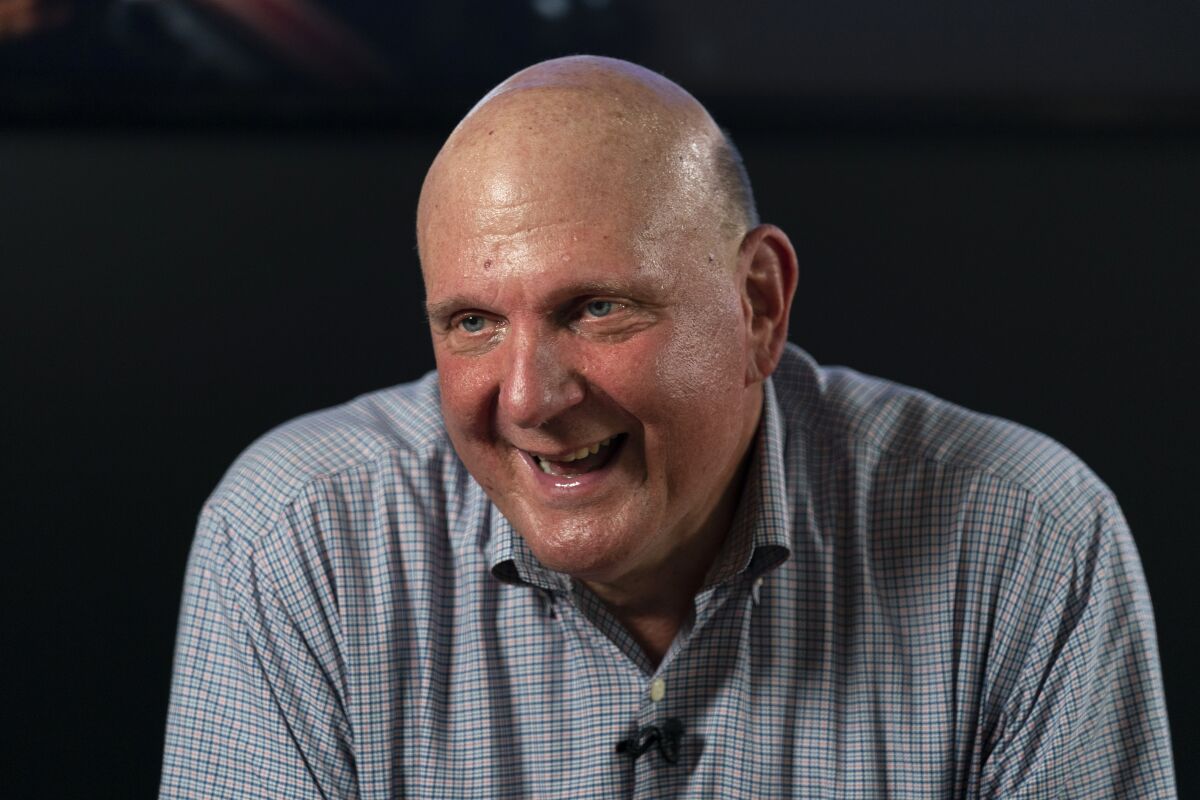 FILE - Los Angeles Clippers owner Steve Ballmer smiles while talking to a reporter during an interview with The Associated Press on Thursday, Sept. 16, 2021, in Los Angeles. Gun violence in America is a public health crisis growing at a pandemic-like pace, says Ballmer, whose nonprofit is trying a new remedy to slow it down.(AP Photo/Jae C. Hong, File)
