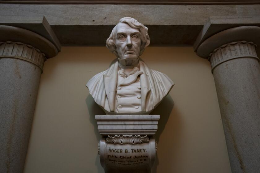 FILE - In this March 9, 2020, file photo a marble bust of Chief Justice Roger Taney is displayed in the Old Supreme Court Chamber in the U.S. Capitol in Washington. Taney, who came from a wealthy, slave-owning family in Calvert County, Md., led the Supreme Court in the 1857 ruling against Dred Scott, an enslaved African American man, who had sued for his freedom. The House is expected to approve a bill Tuesday that would remove from the bust of Taney from the Capitol, as well as statues of Jefferson Davis and others who served in the Confederacy. (AP Photo/J. Scott Applewhite, File)