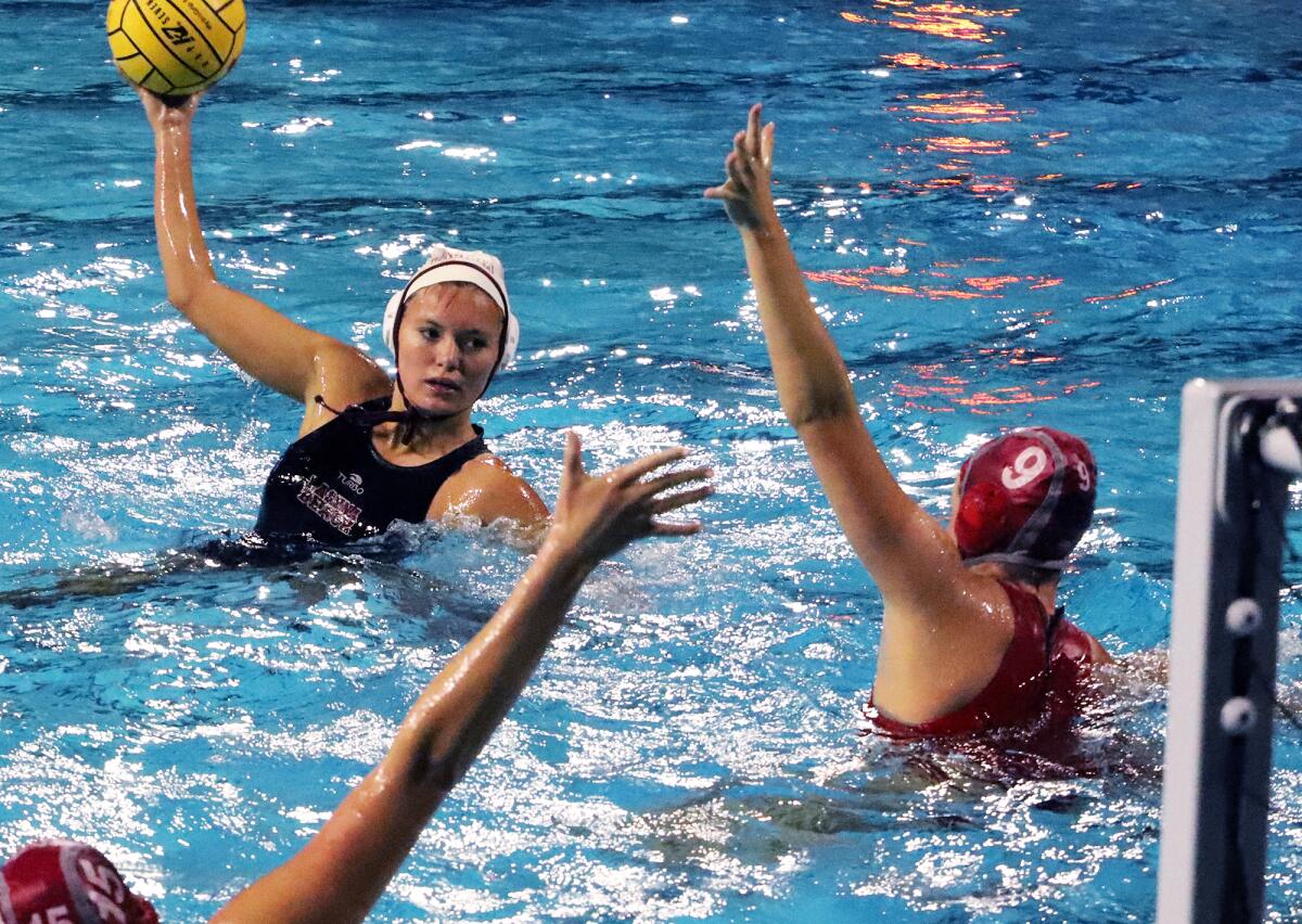 Laguna Beach's Presley Jones (9) tries to shoot past Mater Dei's Emerson Mulvey (9) during the Open Division quarterfinals.