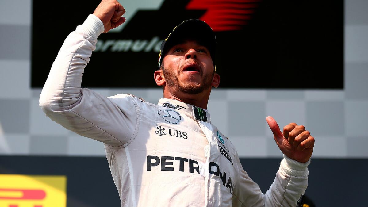 Formula One driver Lewis Hamilton celebrates after winning the Hungarian Grand Prix on Sunday in Budapest.
