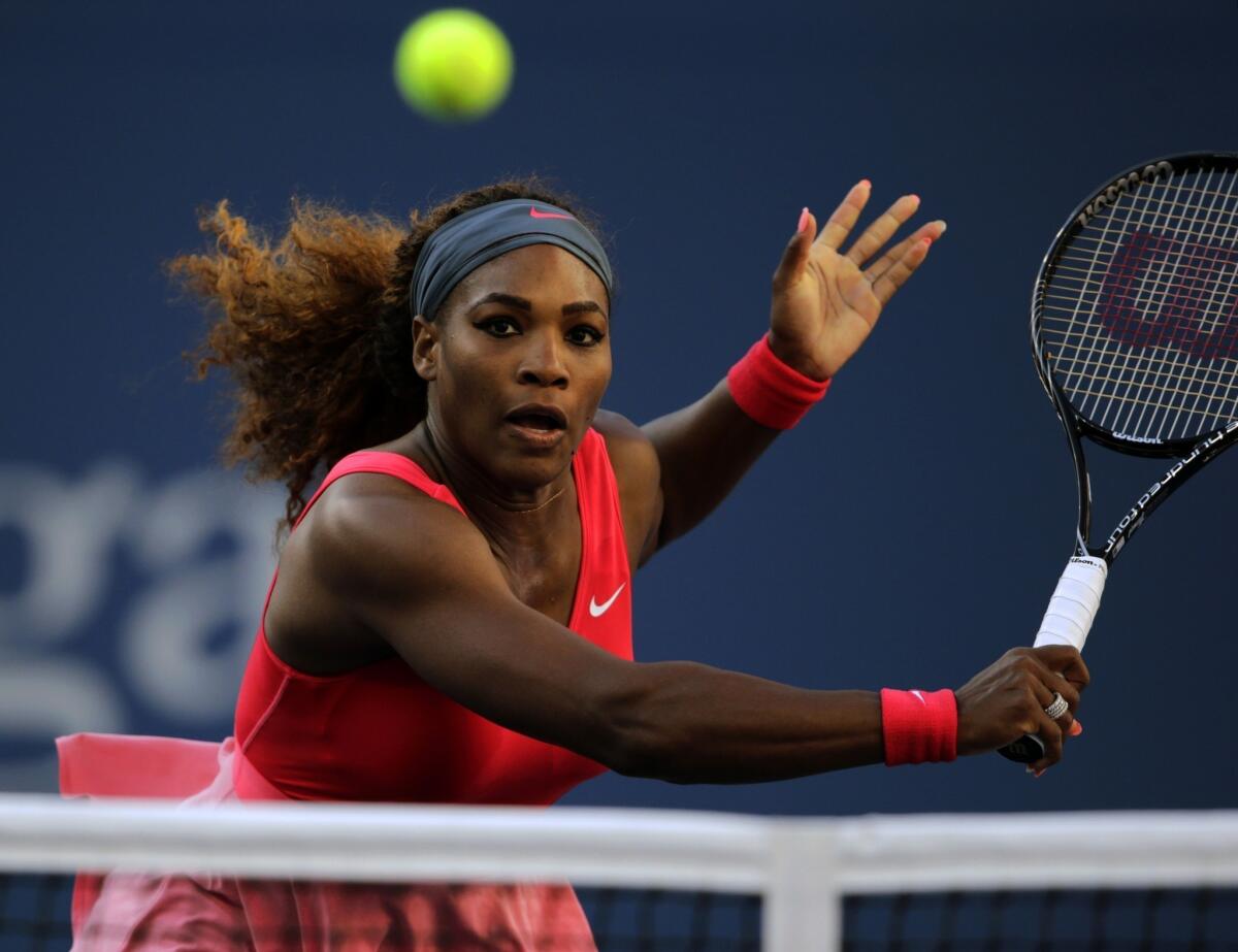 Serena Williams hits a return during her semifinal victory over Li Na at the U.S. Open on Friday.