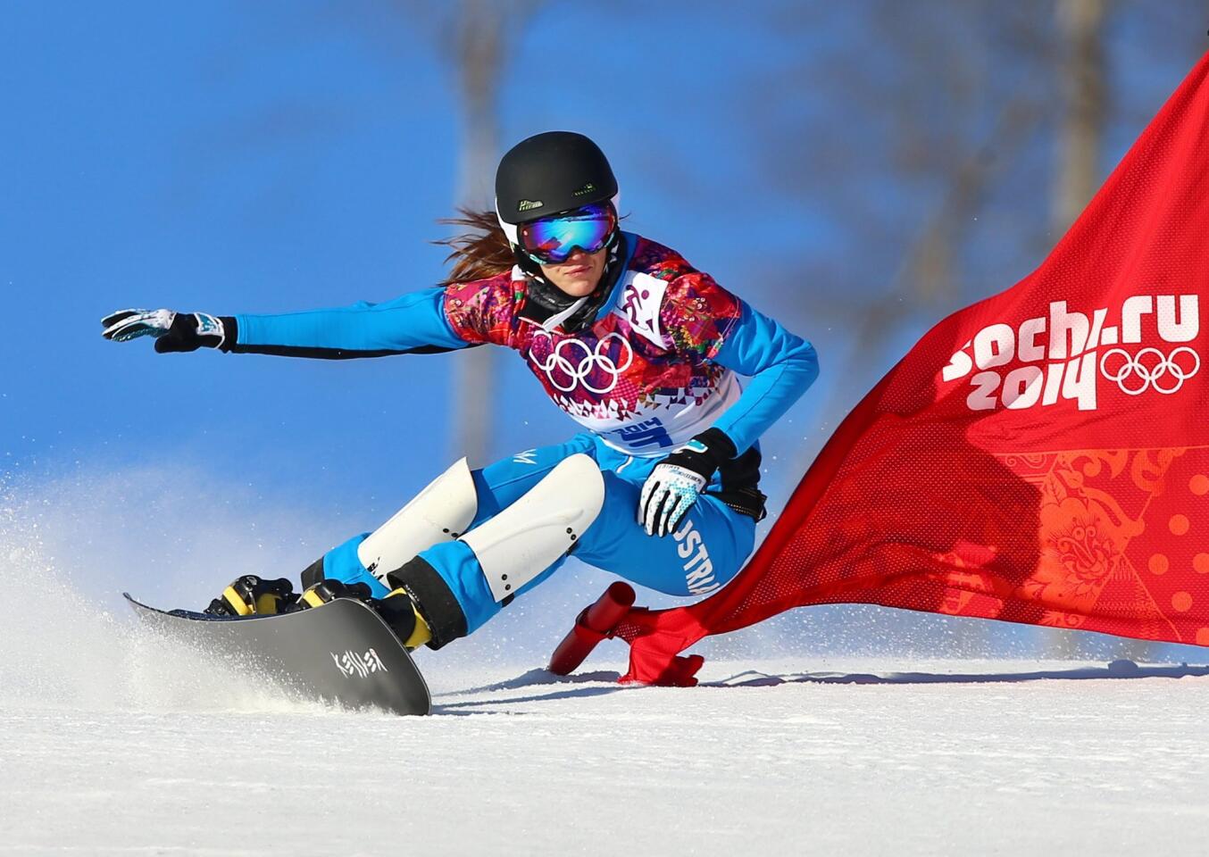 Julia Dujmovits of Austria competes in the women's snowboard parallel slalom.