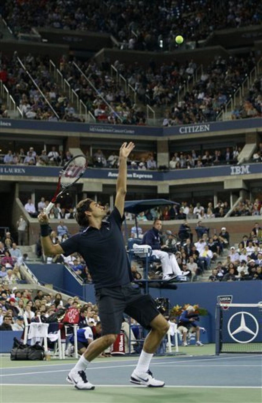 Roger Federer, of Switzerland, serves to Robin Soderling, of Sweden, during a quarterfinal at the U.S. Open tennis tournament in New York, Wednesday, Sept. 8, 2010. (AP Photo/Charles Krupa)
