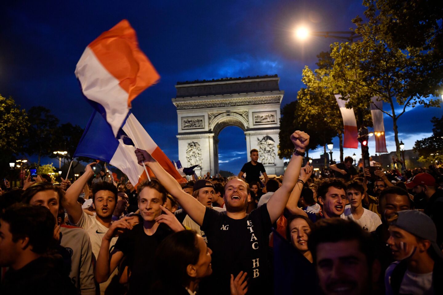 French supporters celebrate on the Champs Elysees after France beat Belgium 1-0 to advance to the World Cup finals.