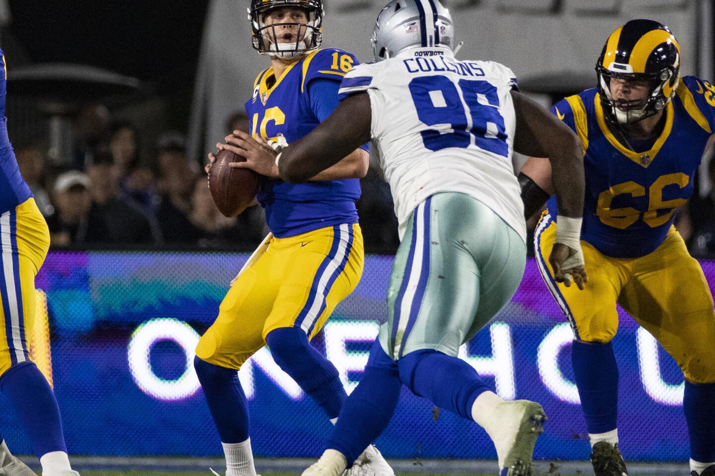 Rams quarterback Jared Goff (16) looks for an open receiver as Cowboys defensive tackle Maliek Collins applies pressure.