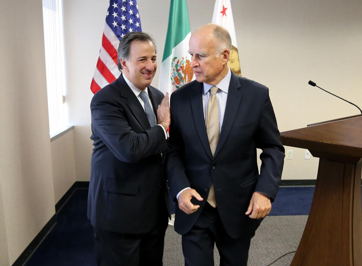 Mexican Secretary of Foreign Affairs José Antonio Meade Kuribreña, left, and Gov. Jerry Brown leave after holding a news conference Wednesday in Sacramento.