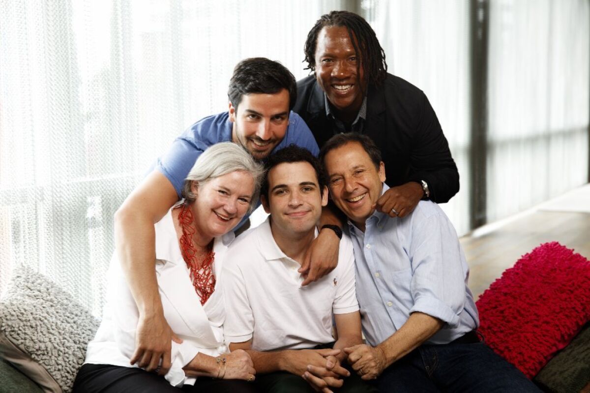 Owen Suskind, center, an autistic young man who is the subject of the documentary "Life Animated" is shown with his family, including, from left, mother Cornelia, brother Walter, father Ron and director Roger Ross Williams.