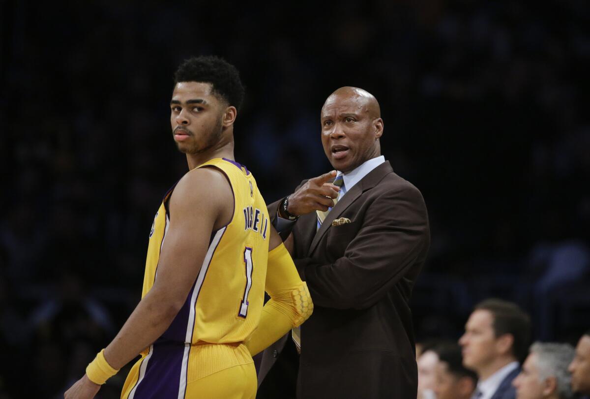 Lakers Coach Byron Scott talks to D'Angelo Russell during the first half of a game against the Atlanta Hawks on March 4 at Staples Center.