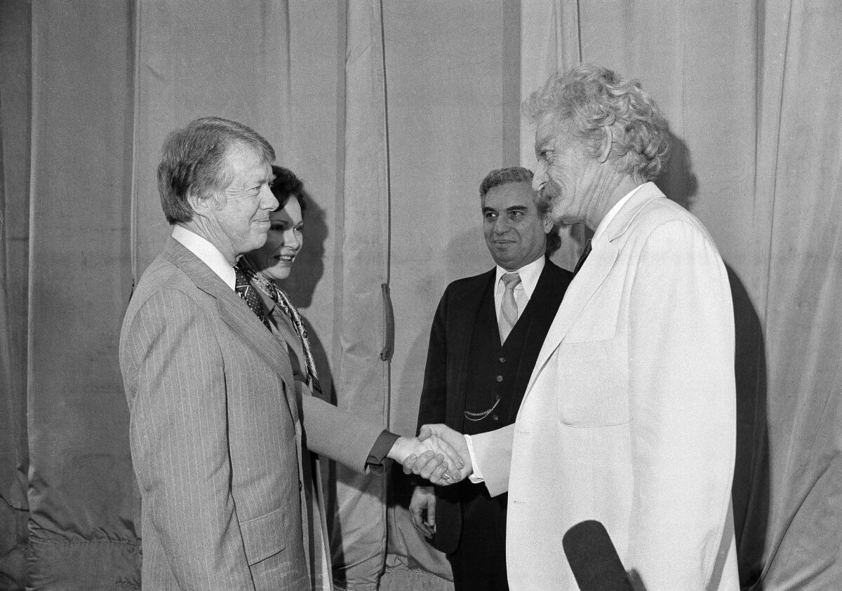 President Jimmy Carter and First Lady Rosalynn Carter meet with actor Hal Holbrook backstage