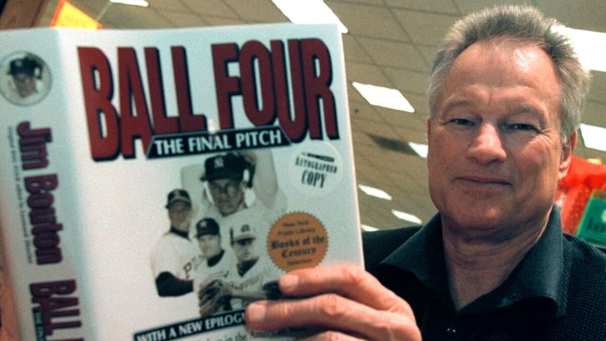 Former major league pitcher Jim Bouton signs copies of his book, "Ball Four: The Final Pitch," in November 2000.
