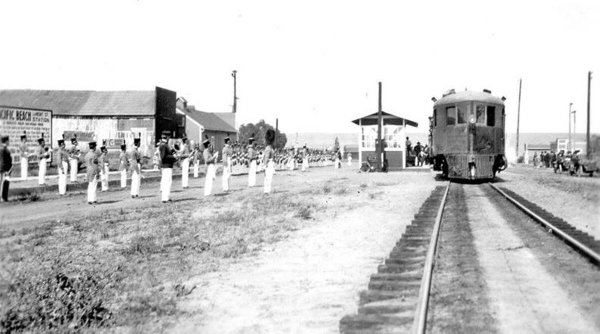 A self-propelled McKeen car stops at the Lamont Street train station in PB around 1915. The photo looks east on Grand Avenue.